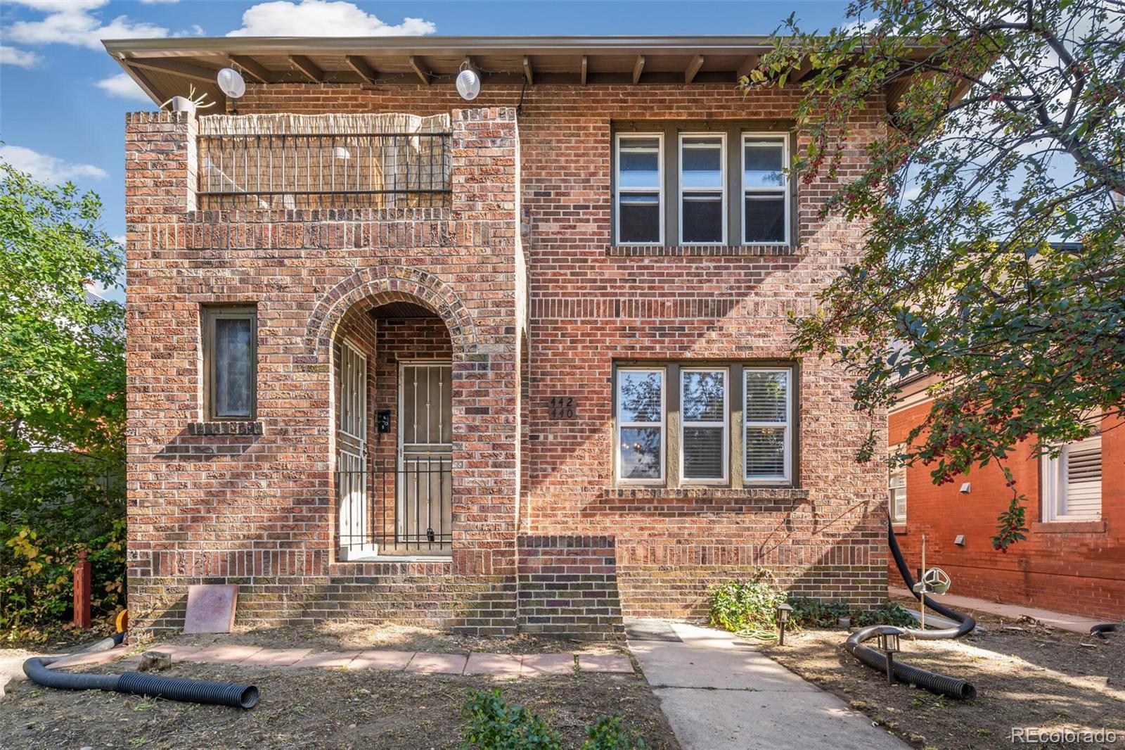 a front view of a house with yard