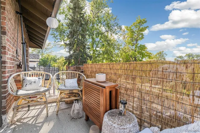 a view of a balcony with chairs