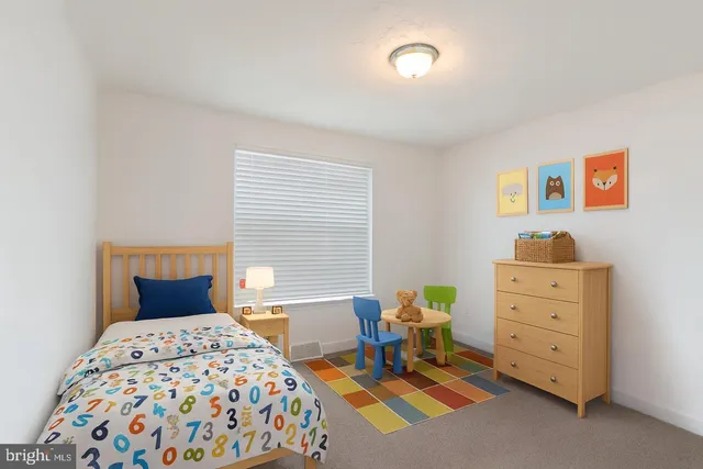 a bedroom with a bed and a cabinets