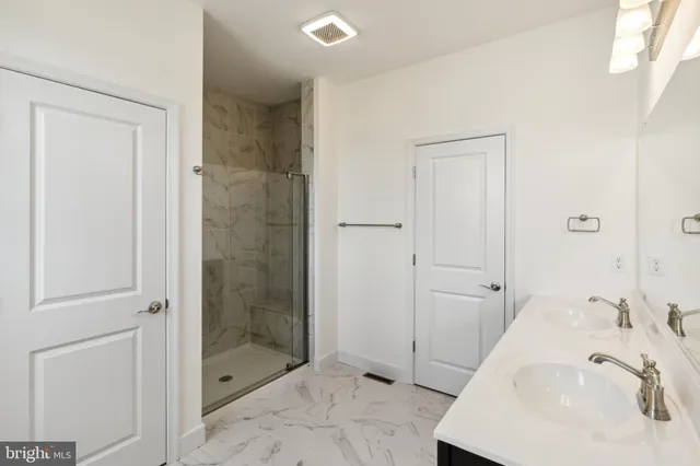 a bathroom with a sink and a shower