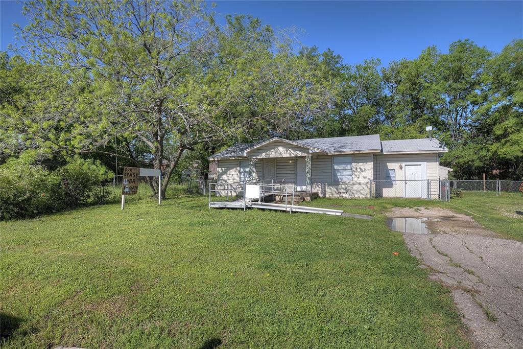8782 Highway 34 Quinlan, TX 75474 - Photo 18 of 37 a front view of a house with yard patio and green space