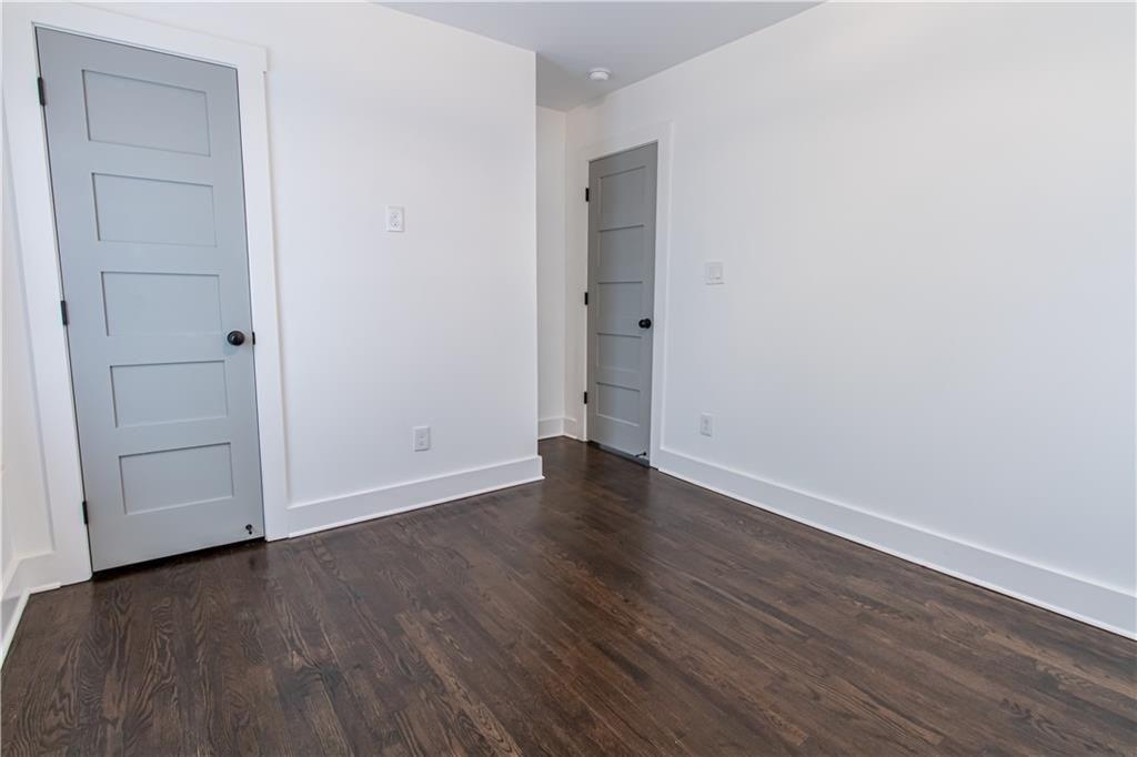 3548 Glensford Drive Decatur, GA 30032 - Photo 18 of 47 a view of an empty room with wooden floor