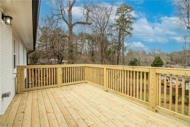 a bathroom with a toilet and a mirror