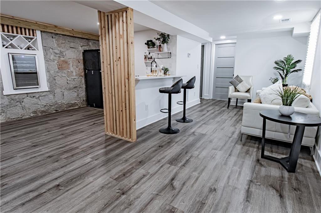 3548 Glensford Drive Decatur, GA 30032 - Photo 36 of 47 a living room with furniture and a wooden floor