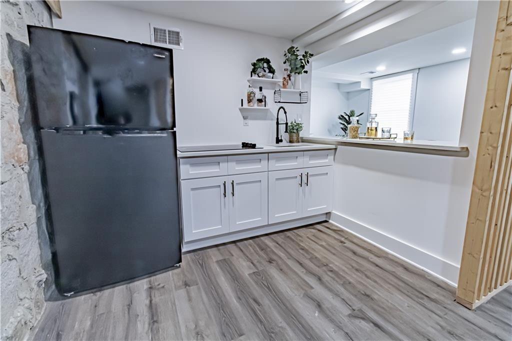 3548 Glensford Drive Decatur, GA 30032 - Photo 37 of 47 a kitchen with stainless steel appliances granite countertop a refrigerator and a sink