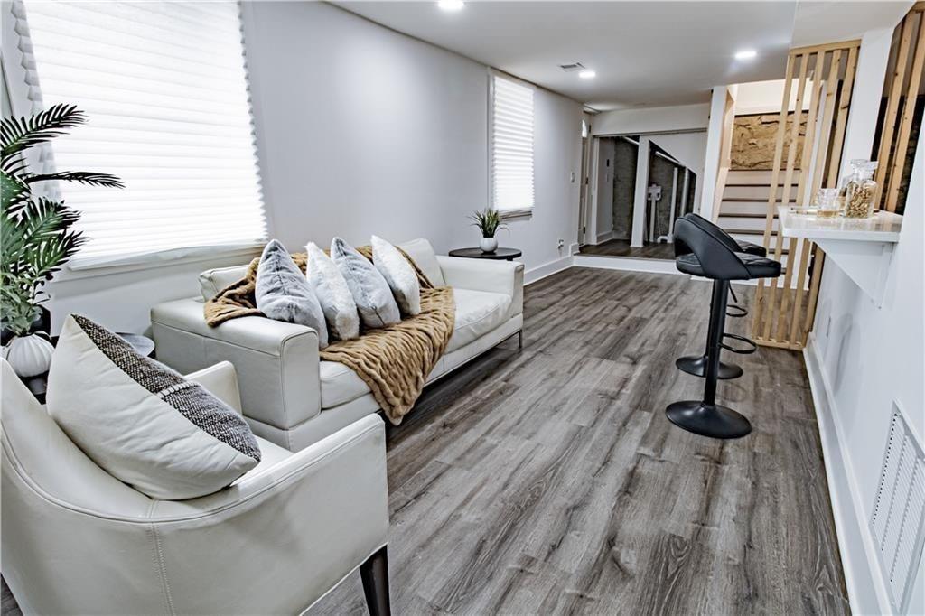 3548 Glensford Drive Decatur, GA 30032 - Photo 39 of 47 a living room with furniture and a wooden floor