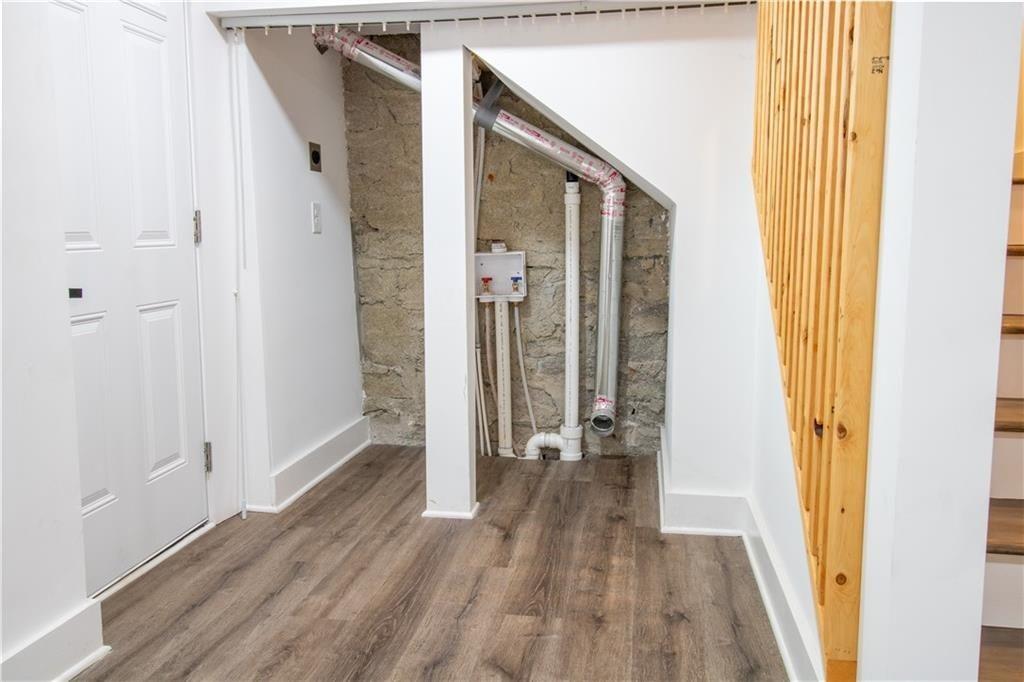 3548 Glensford Drive Decatur, GA 30032 - Photo 40 of 47 a view of a hallway with wooden floor and staircase