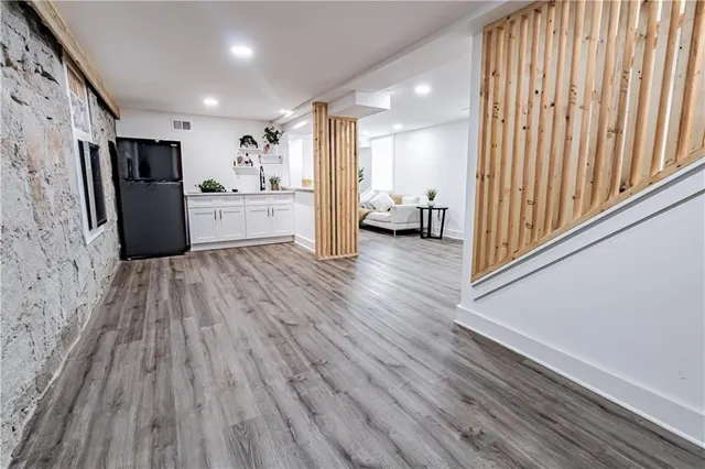 a front view of a house with a wooden floor