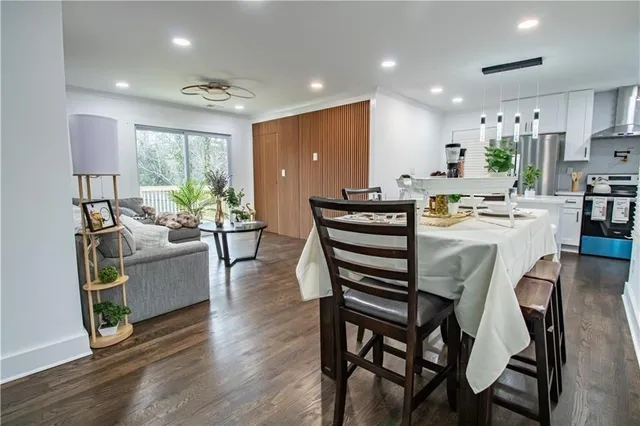 a view of a dining room with furniture window and wooden floor