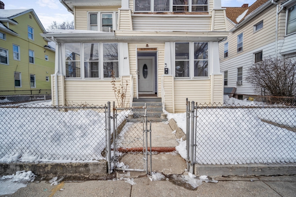 40-42 Ranney Street Springfield, MA 01108 - Photo 1 of 37 front view of a brick house with a bench