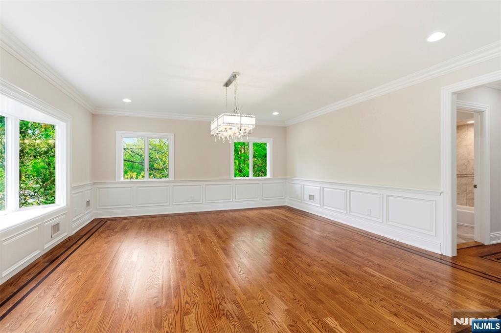 767 Orangeburgh Road River Vale, NJ 07675 - Photo 18 of 49 an empty room with wooden floor and windows