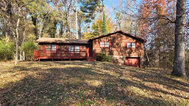 a view of a house with a yard next to a road