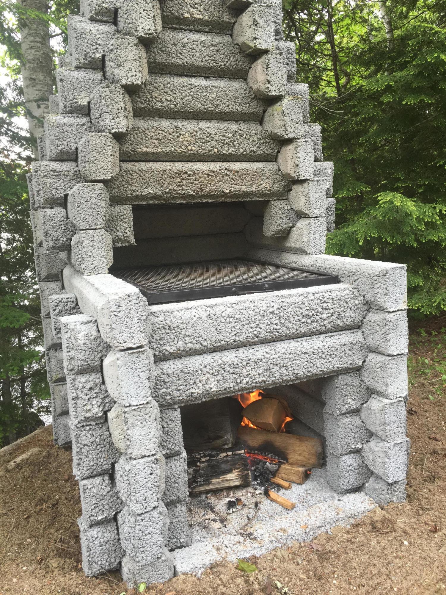 271 Patten Pond Road Surry, ME 04684 - Photo 31 of 32 outdoor fireplace