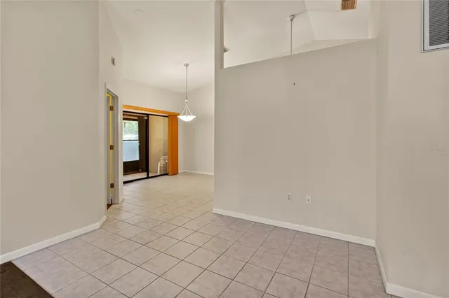 a view of a kitchen with a microwave and a sink