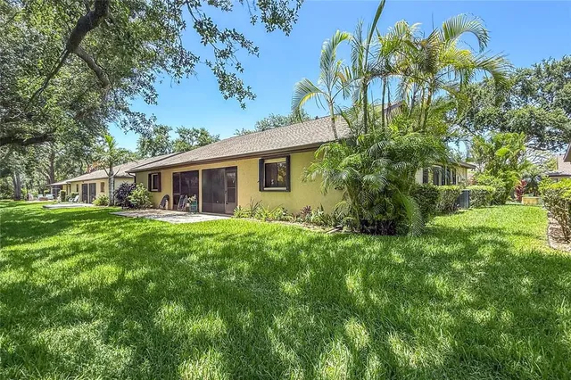 a view of a house with a backyard