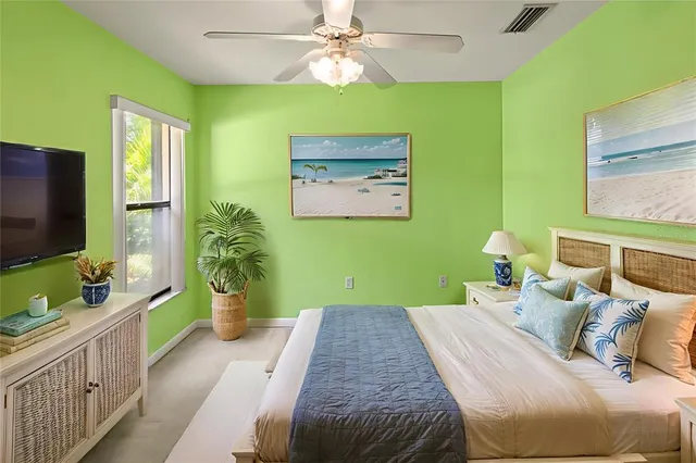 an empty room with wooden door and a bathroom