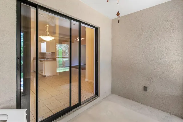 a dining room with furniture and a chandelier