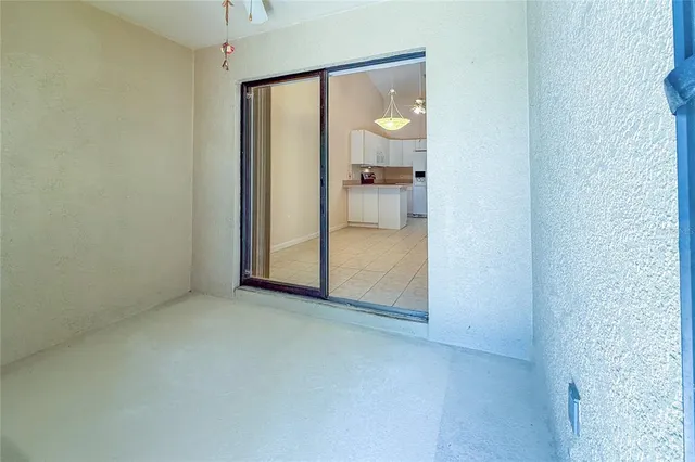 a kitchen with a table and chairs in it