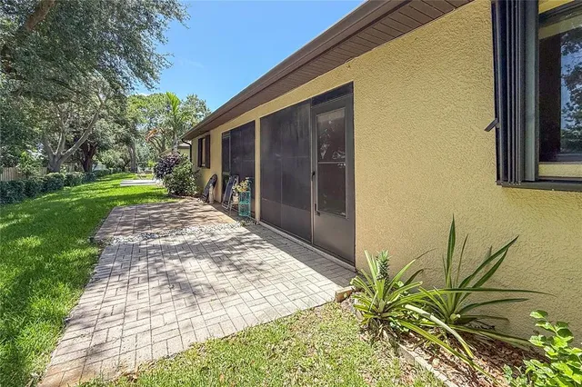 a view of a backyard with pathway