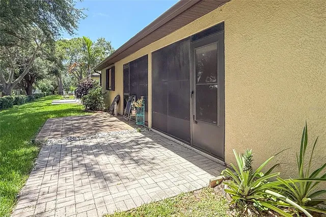 a view of a backyard with pathway