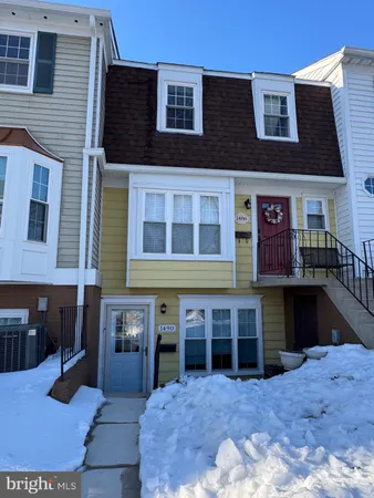 a kitchen with stainless steel appliances a refrigerator sink and wooden floor