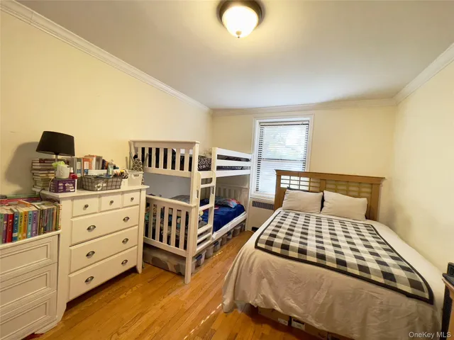 a bedroom with a bed and dresser