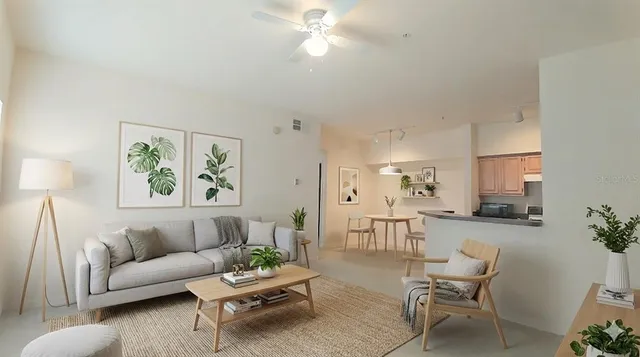 a living room with furniture and a potted plant