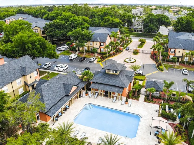 an aerial view of a house with a swimming pool