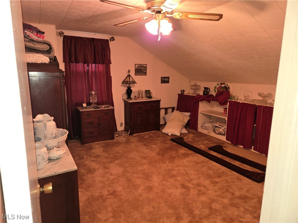 1962 Zenobia Road Norwalk, OH 44857 - Photo 17 of 30 Bedroom with carpet floors, ceiling fan, and lofted ceiling