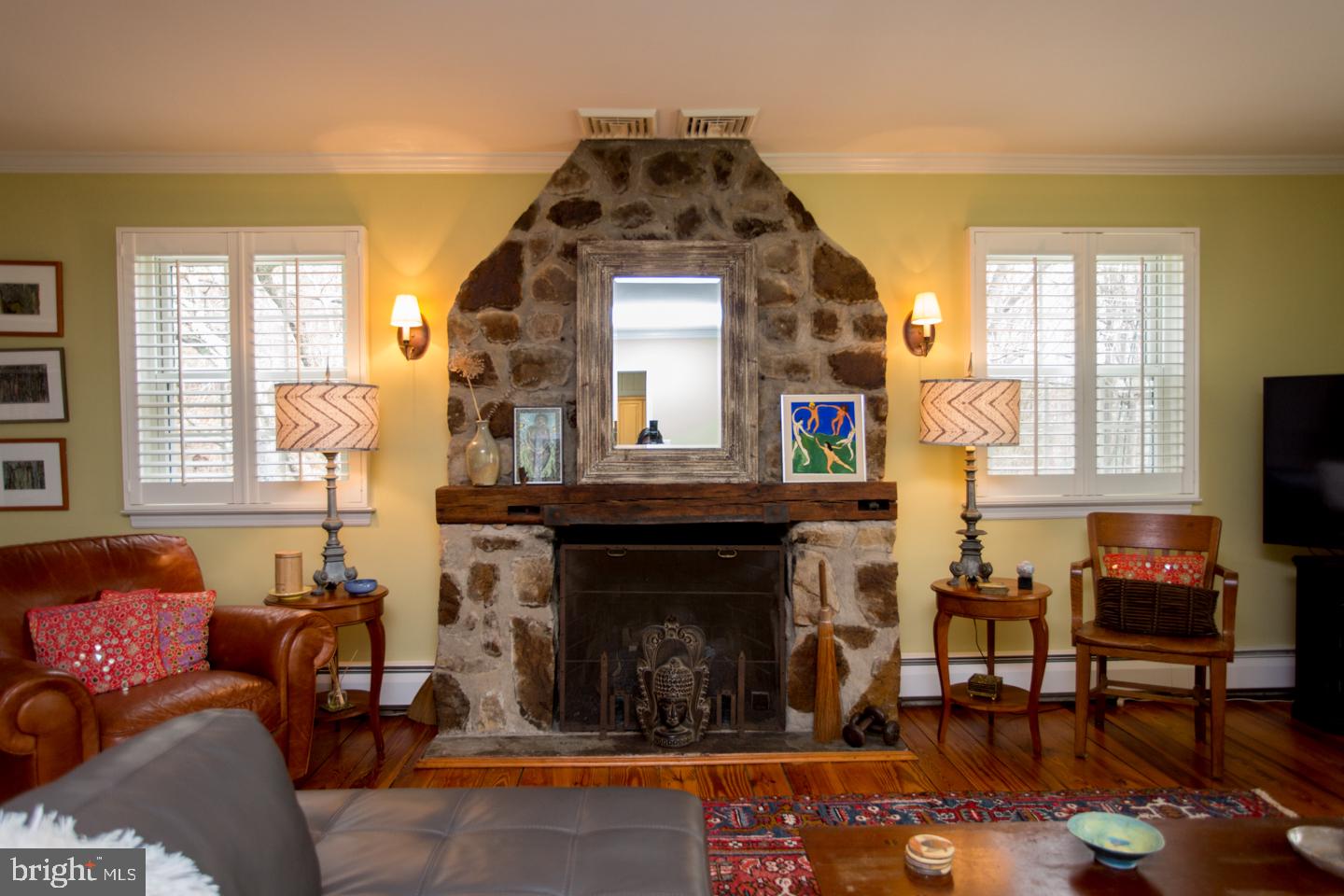 4774 Lower Mountain Road New Hope, PA 18938 - Photo 4 of 26 Great room stone fireplace & plantation shutters