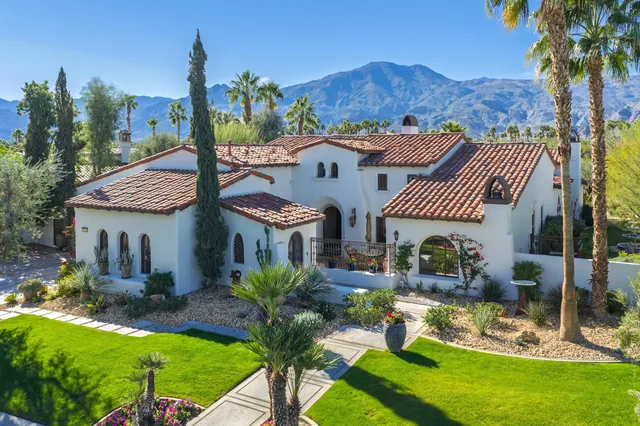 an aerial view of residential building and trees