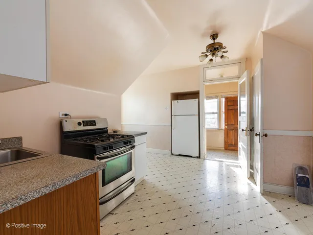 a kitchen with a stove and a sink