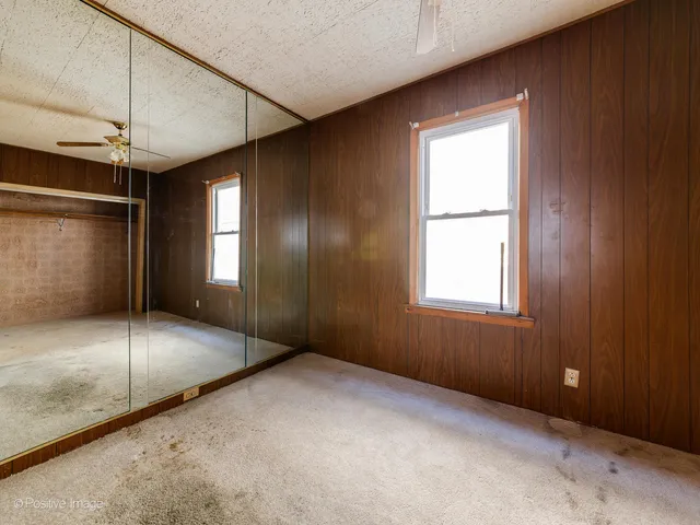 an empty room with fan