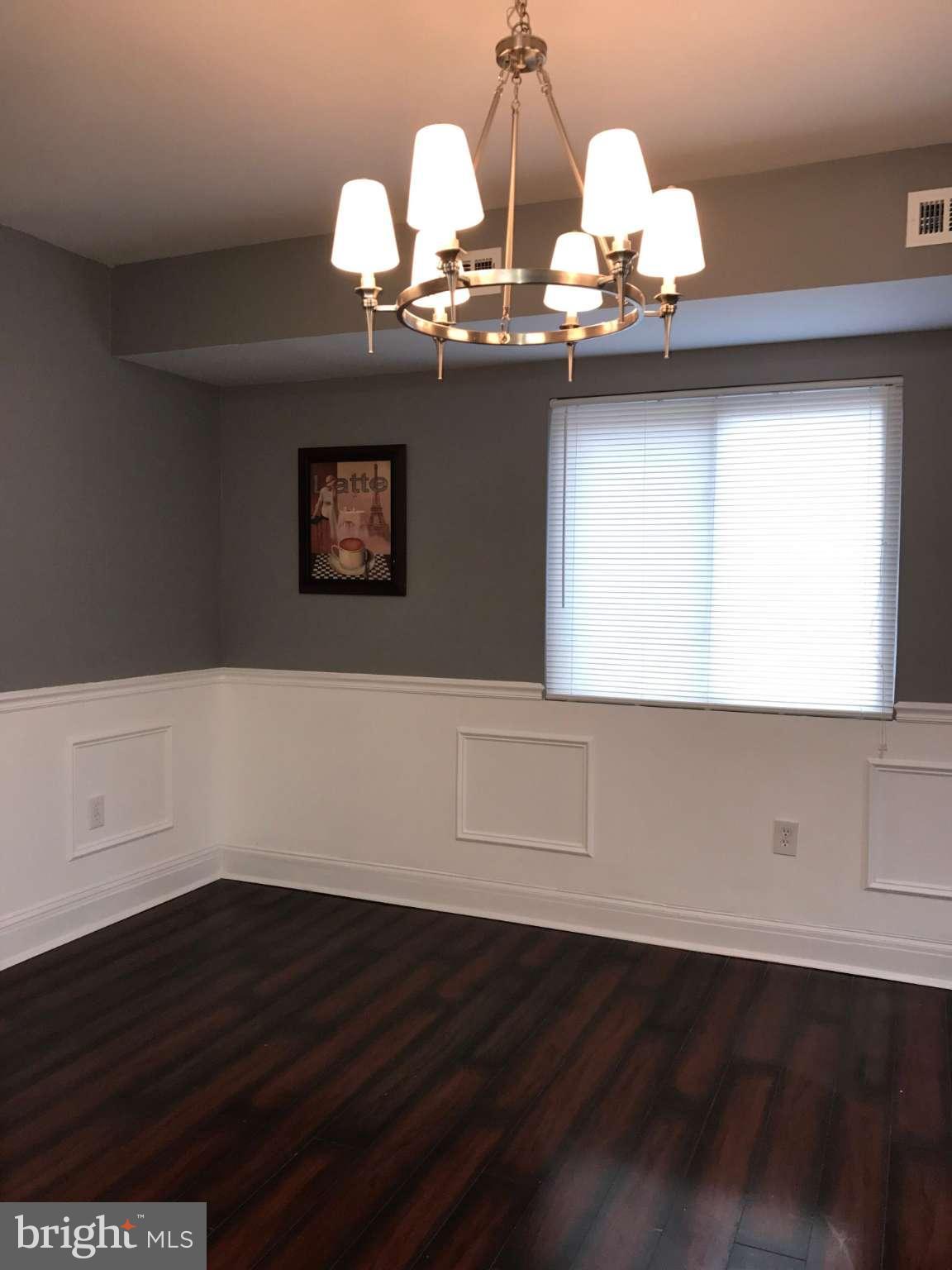 3733 Elkader Road Baltimore, MD 21218 - Photo 16 of 26 a view of a workspace with wooden floor