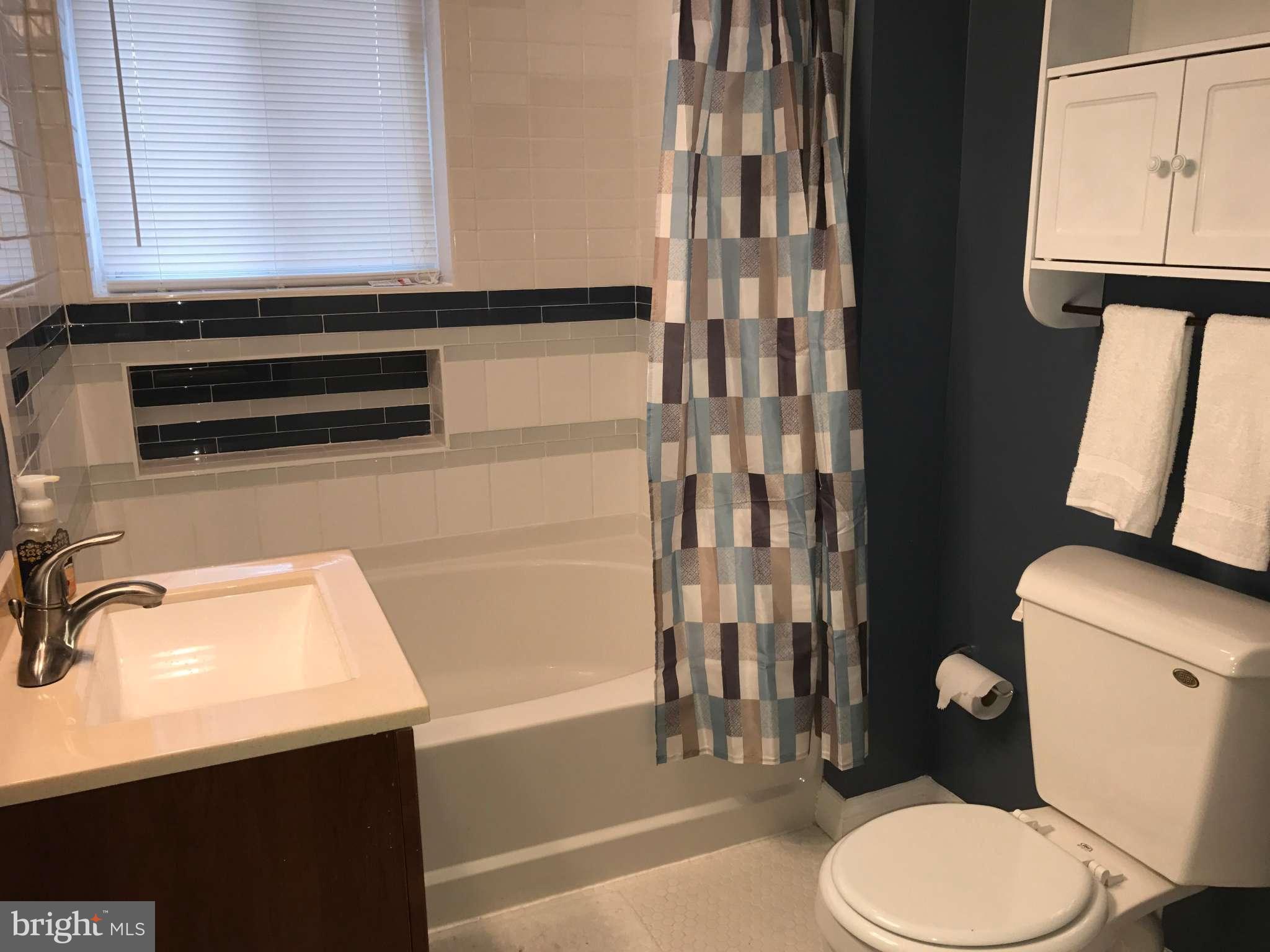 3733 Elkader Road Baltimore, MD 21218 - Photo 20 of 26 a bathroom with a sink a toilet and shower