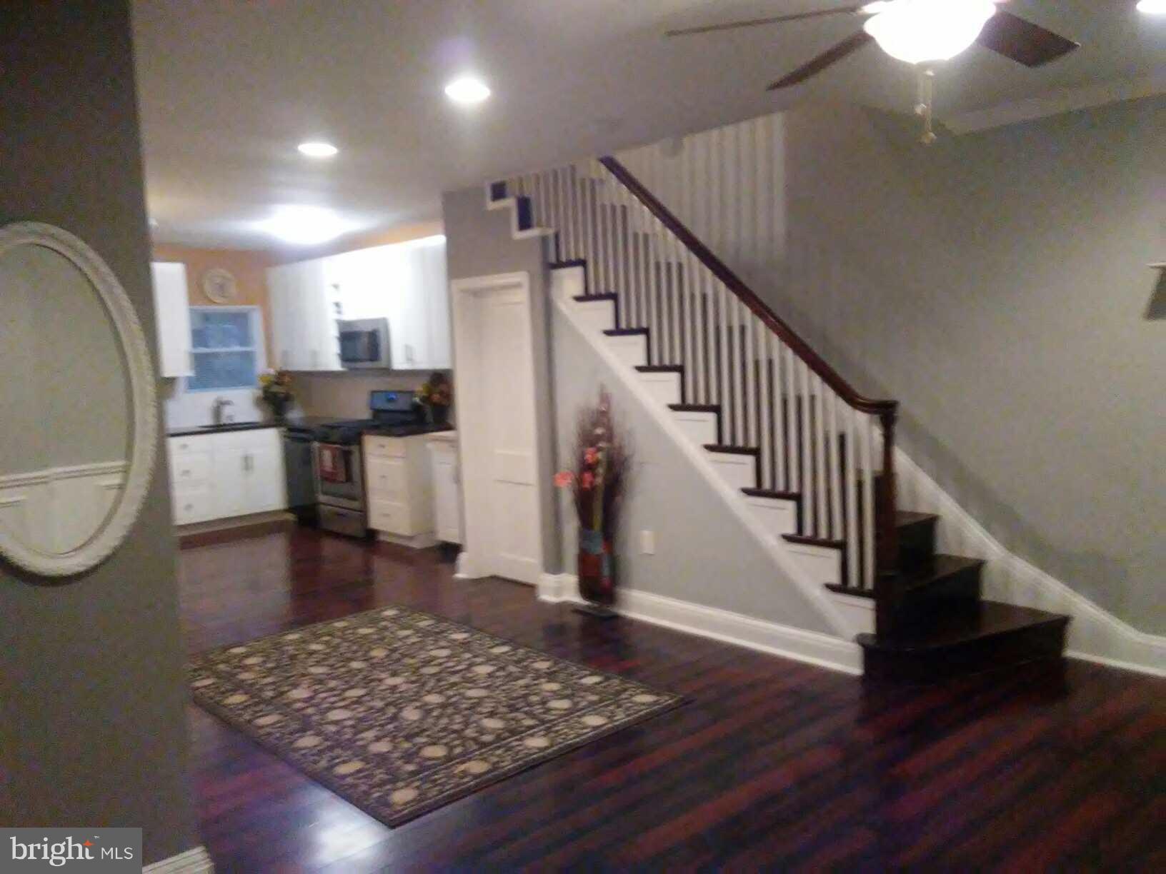 3733 Elkader Road Baltimore, MD 21218 - Photo 3 of 26 a view of entryway and hall with wooden floor