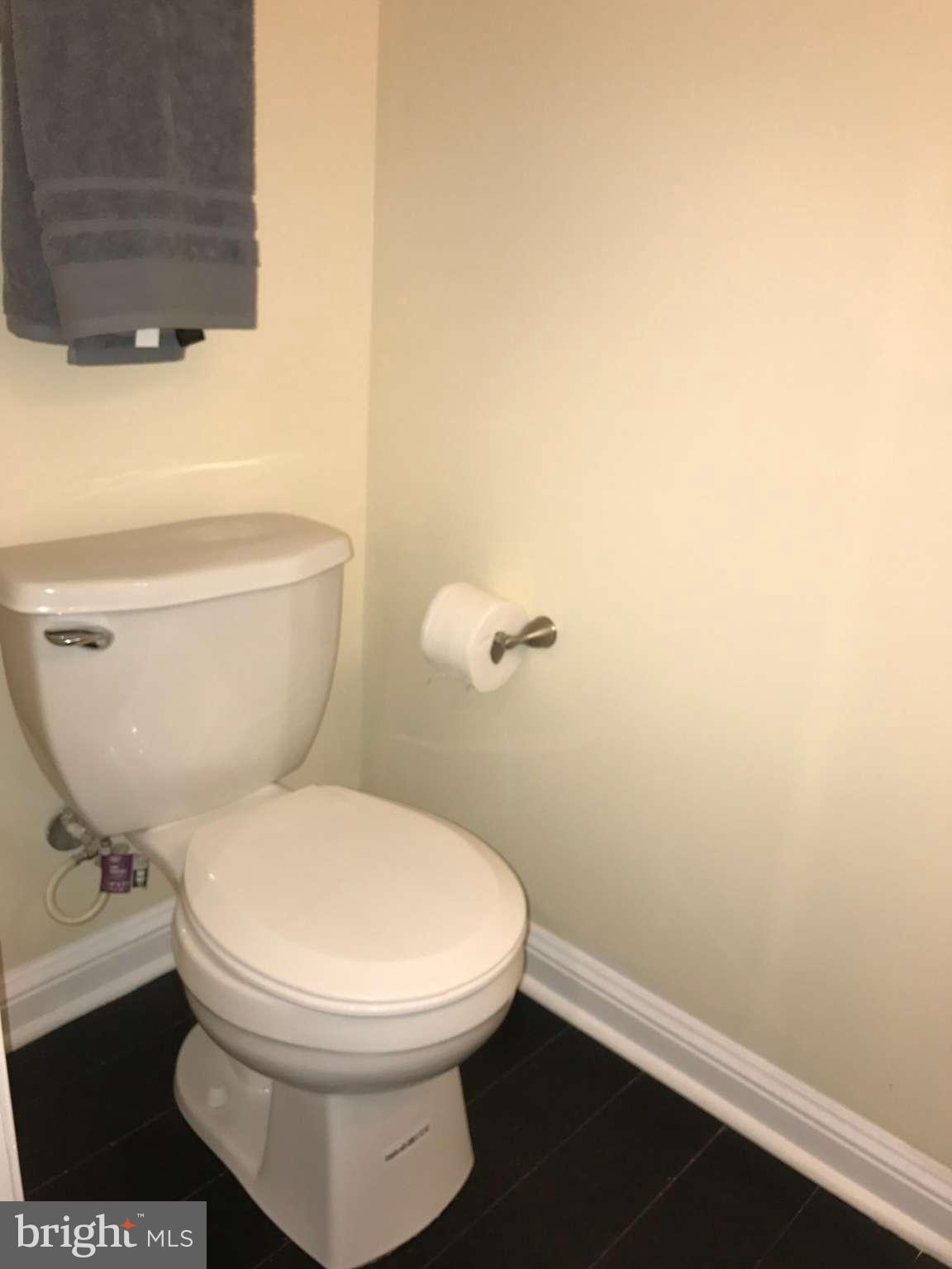 3733 Elkader Road Baltimore, MD 21218 - Photo 24 of 26 a white toilet sitting next to a shower