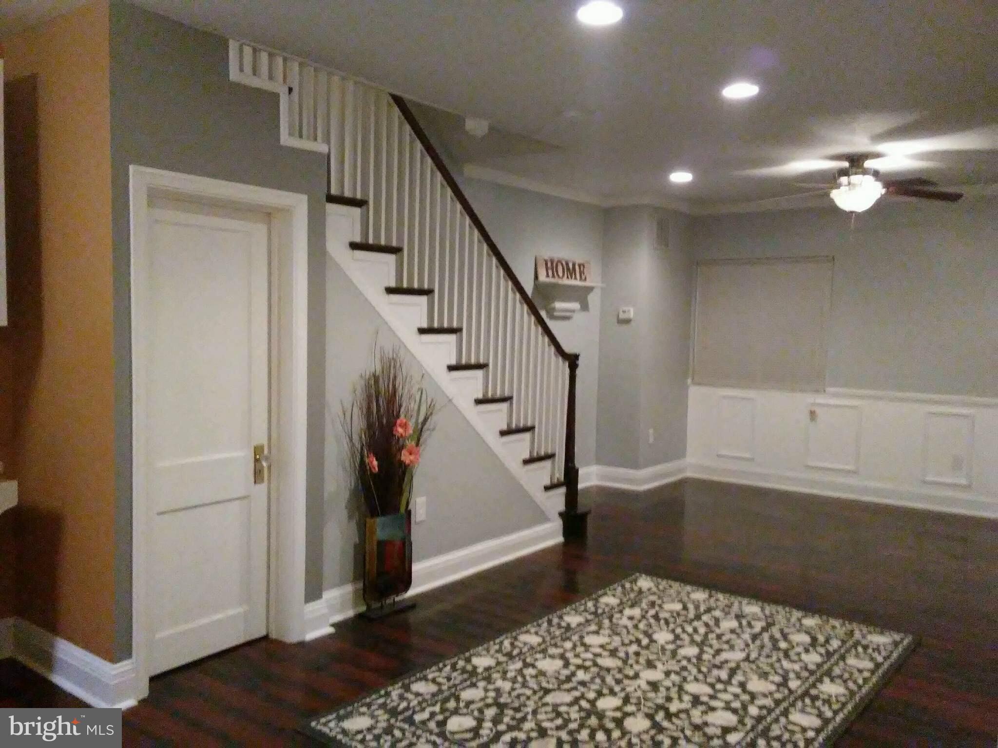 3733 Elkader Road Baltimore, MD 21218 - Photo 6 of 26 a view of entryway with stairs and wooden floor