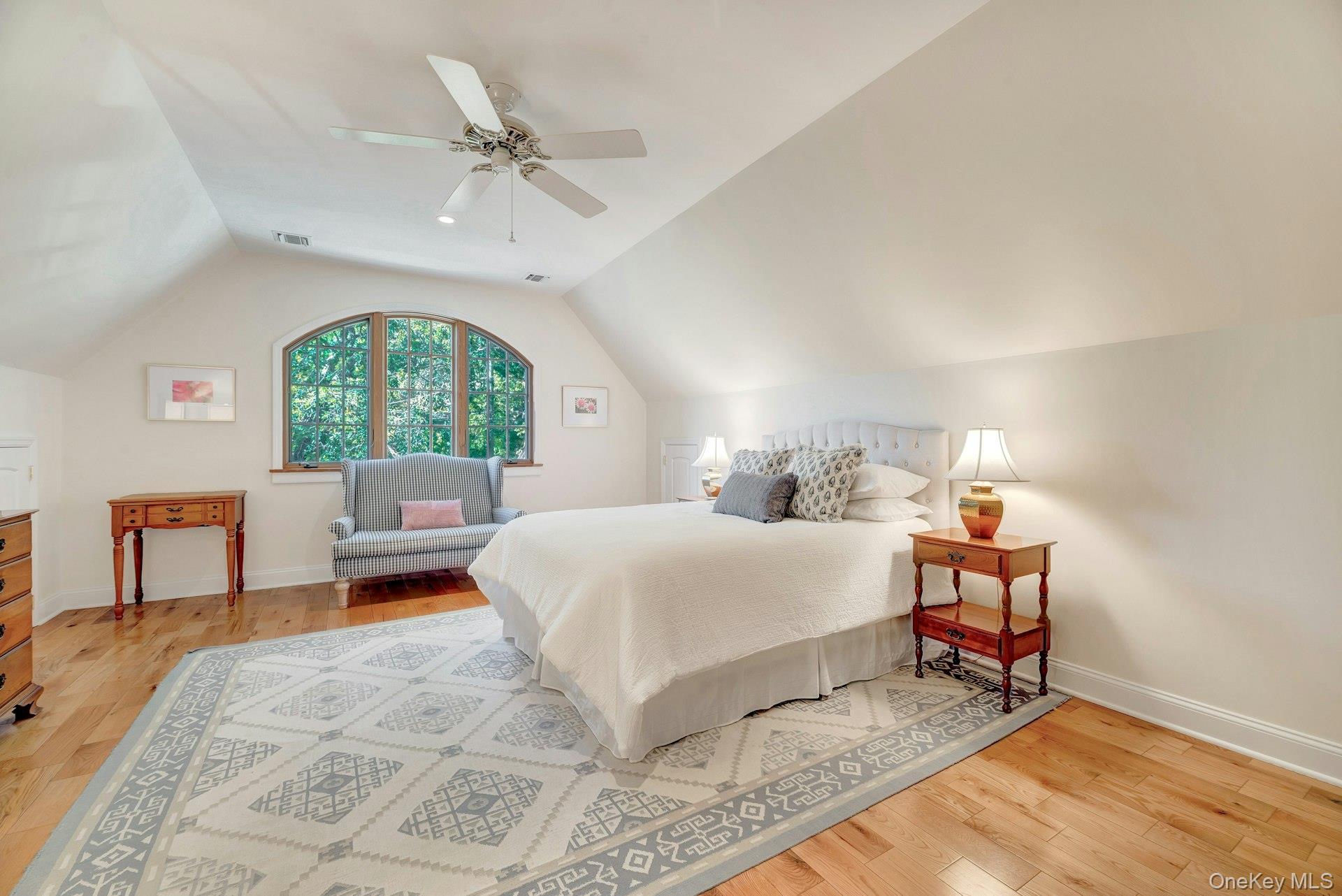 3600 Rocky Point Road East Marion, NY 11939 - Photo 22 of 45 a bedroom with a bed and a chair