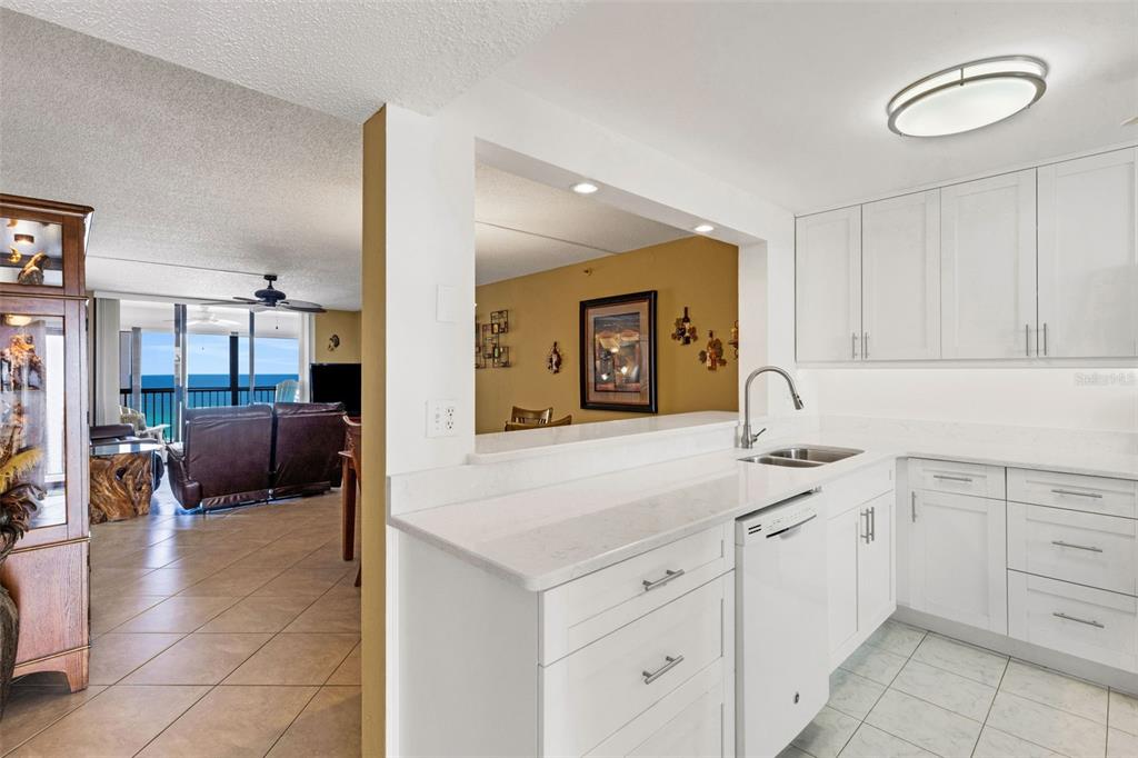 14900 Gulf Boulevard, Unit 410 Madeira Beach, FL 33708 - Photo 37 of 76 a spacious en suite bathroom with a double vanity sink and a mirror