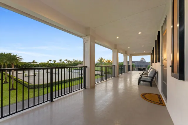 a view of a floor to ceiling window and an outdoor seating