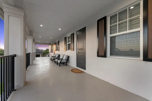 a view of a livingroom with furniture and a window