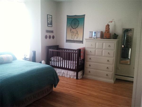 16 Beacon Street, Unit 11 Chelsea, MA 02150 - Photo 12 of 14 a bedroom with a bed and a dresser