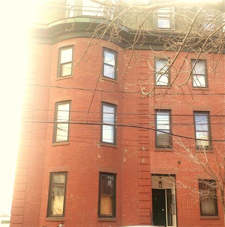 16 Beacon Street, Unit 11 Chelsea, MA 02150 - Photo 2 of 14 a brick building with a large windows