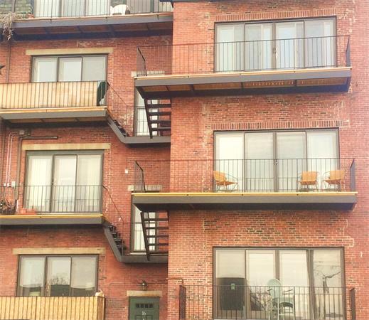 16 Beacon Street, Unit 11 Chelsea, MA 02150 - Photo 3 of 14 a front view of a building with a window