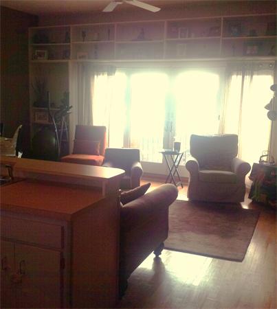 16 Beacon Street, Unit 11 Chelsea, MA 02150 - Photo 7 of 14 a living room with furniture and a large window