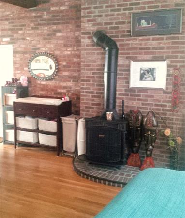16 Beacon Street, Unit 11 Chelsea, MA 02150 - Photo 9 of 14 a view of a wooden bench next to a brick wall