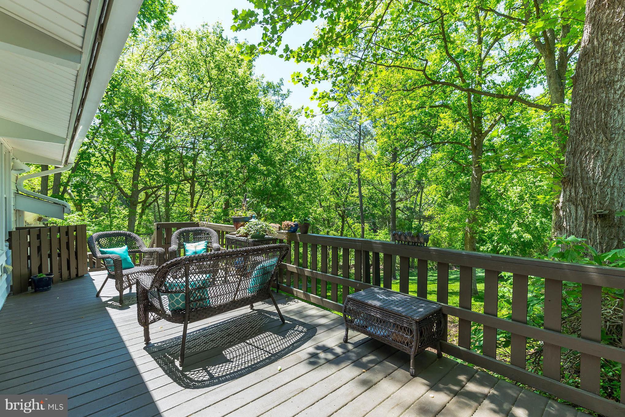 510 Swaggers Point Road Solomons, MD 20688 - Photo 11 of 30 a view of a wooden deck with furniture