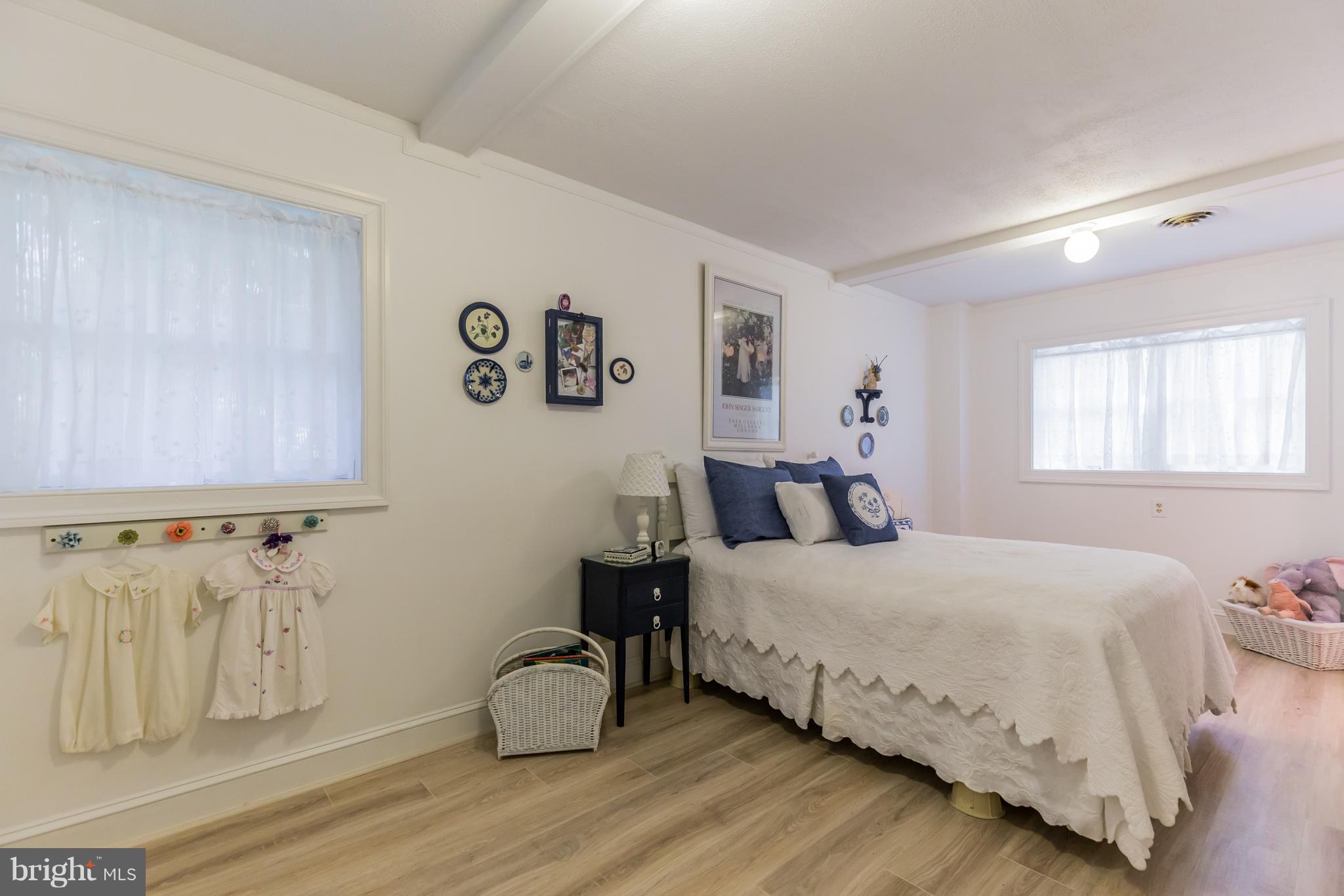 510 Swaggers Point Road Solomons, MD 20688 - Photo 17 of 30 a bedroom with a bed and a window