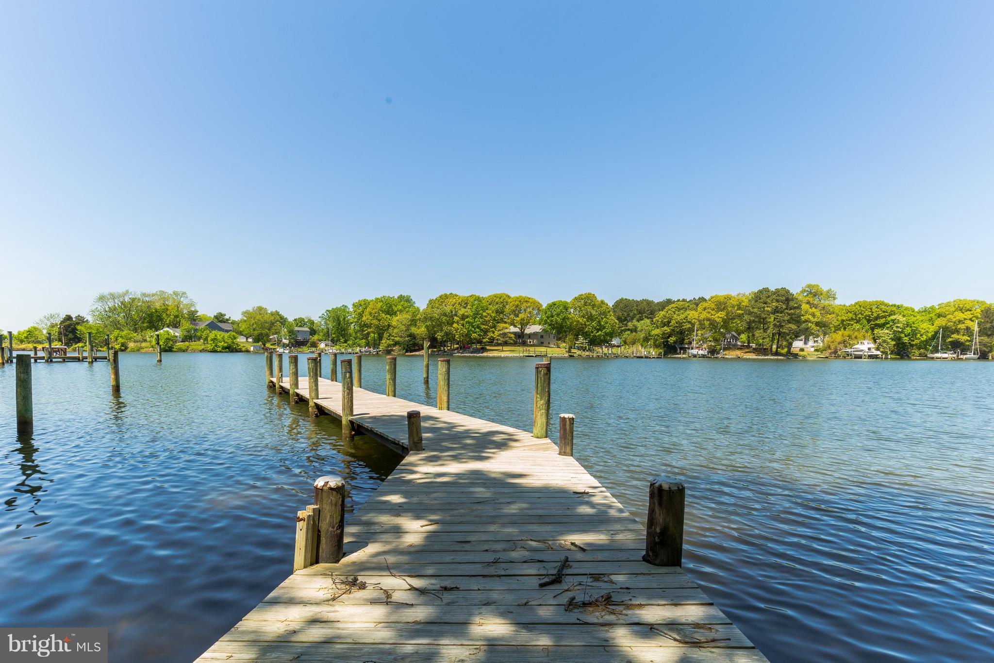 510 Swaggers Point Road Solomons, MD 20688 - Photo 26 of 30 a view of a lake and trees in front of it